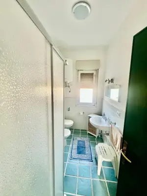 a bathroom with a shower and a sink and a toilet at Villa Donna Toni in Carini