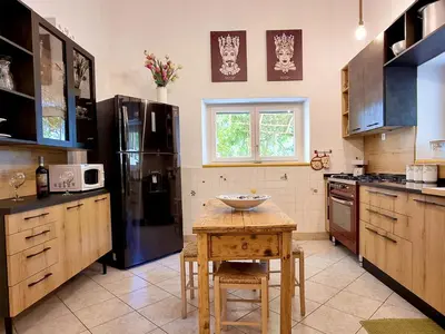 a kitchen with a table with a bowl on it at Villa Tommaso Maruggi, Sicilia, con Jacuzzi e piscina privata in Alcamo