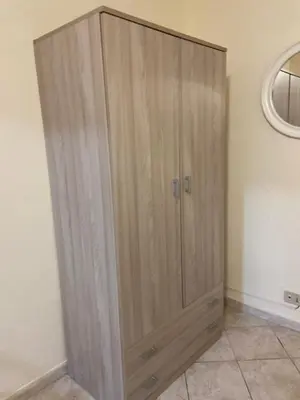 a wooden cabinet in the corner of a room at Alle spalle della cattedrale in Palermo