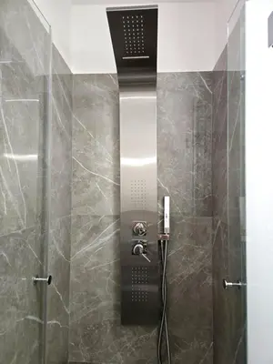 a bathroom with a shower with a shower head at Vicoletto Ludovica - Proppro SRL- Palermo in Palermo