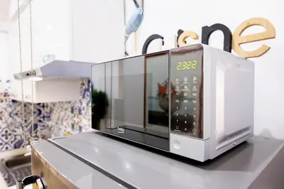 a microwave oven sitting on top of a counter at La Casa di Freda in Palermo