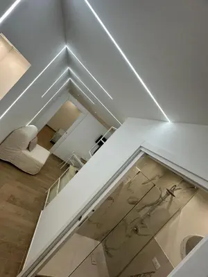 a room with a white ceiling and a glass floor at Glamour home in Palermo