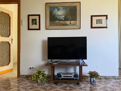 a flat screen tv sitting on a table in a living room at Villa Melina in Carini
