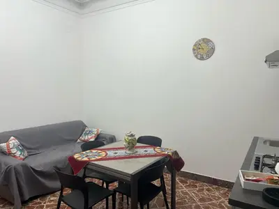 a living room with a couch and a table at Trinacria in Capaci