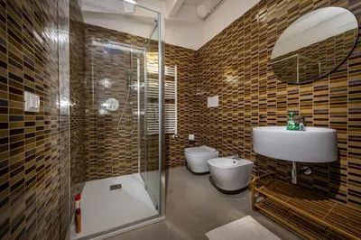 a bathroom with a shower and a sink and a toilet at Terrazza BluOltremare, Castellammare del Golfo in Castellammare del Golfo