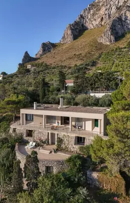 a house on the side of a mountain at Seaside Villa Capo Zafferano in Bagheria
