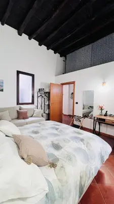 a bedroom with a large bed in a room at Kasa Magnisi in Palermo
