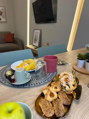 a table with a plate of breakfast foods on it at I Saraceni Cattedrale in Palermo