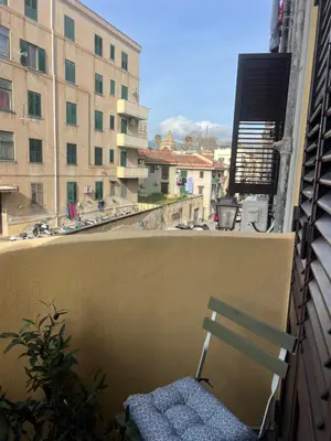 a chair sitting on the ledge of a balcony at I Saraceni Cattedrale in Palermo