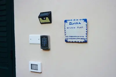 a bedroom with a large bed with a blue wall at Elvira Studio Flat,Via Dante,near Lolli station in Palermo