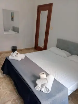 a hotel room with two towels on a bed at Framami Red Ballerino in Palermo