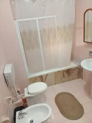 a bathroom with a toilet and a sink at Framami Red Ballerino in Palermo