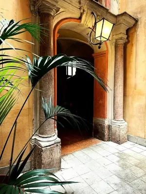 an entrance to a building with a plant in front at Luxury Apartment Palazzo Vannucci in Palermo