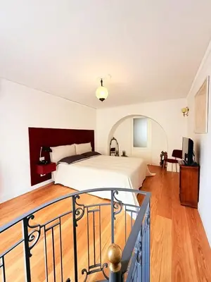 a bedroom with a bed and a balcony at Luxury Apartment Palazzo Vannucci in Palermo