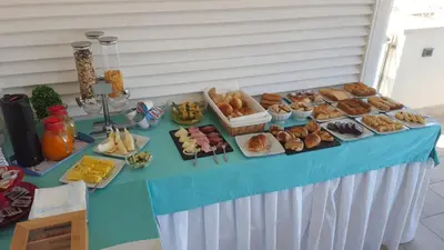 a table topped with lots of different types of food at Accussì rooms in San Vito lo Capo