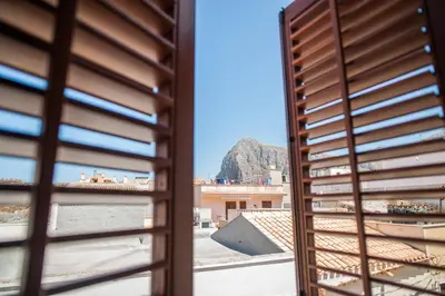 a view of a mountain from a window at Accussì rooms in San Vito lo Capo