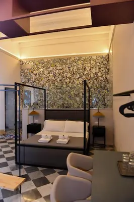 a bedroom with a bed and a checkered floor at Mamamia #Teatro Biondo in Palermo