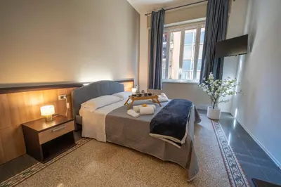 a bedroom with a bed and a window at La zagara di Alba in Palermo