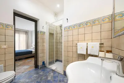 a bathroom with a sink and a toilet and a shower at Le Margherite in San Vito lo Capo