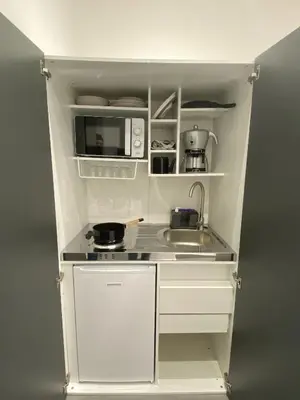 a small kitchen with a sink and a microwave at CASE VACANZE FraEmily , PALERMO in Palermo