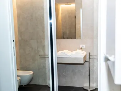 a bathroom with a sink and a mirror at Casa delle Maioliche in Palermo