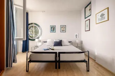 a white bedroom with a bed in a room at villa Capo Zafferano in Bagheria