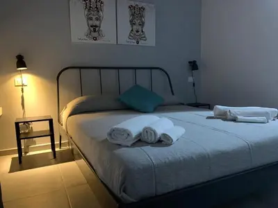 a bedroom with a bed with towels on it at Dai Mori in Lascari