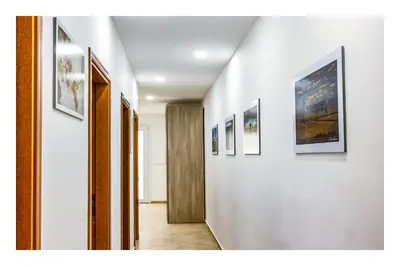 a hallway with several pictures on the walls at Battigia SOLEMAR-Alcamo Marina in Alcamo Marina