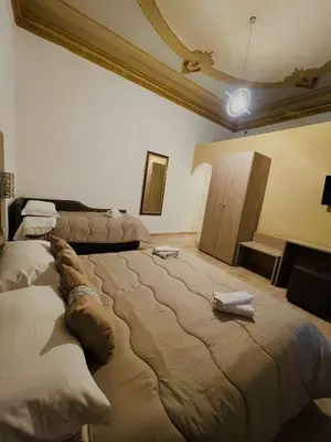 a hotel room with two beds in a room at Alberto1 in Palermo