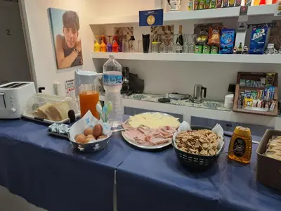 a blue table topped with bowls of food and drinks at Alberto1 in Palermo