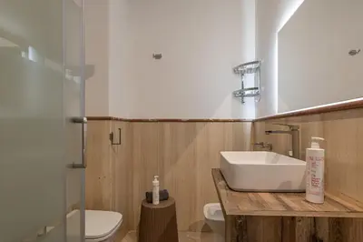 a bathroom with a sink and a toilet at Kadì Apartment by Wonderful Italy in Palermo