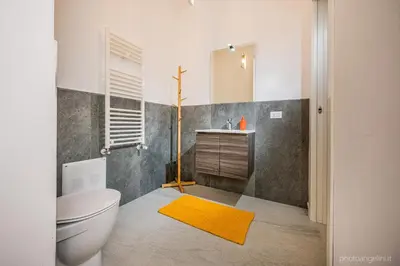 a bathroom with a white toilet and a sink at VILLA AGLEA Luxury By Sicily Home Solutions in Castellammare del Golfo