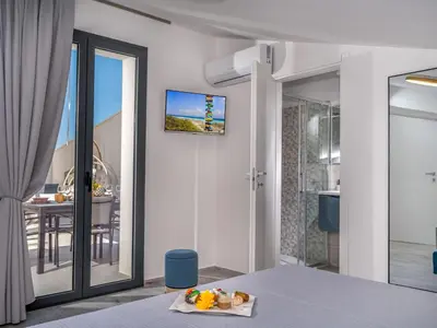 a room with a bedroom with a television on the wall at Apartment Attico Dolce Vista by Interhome in Castellammare del Golfo