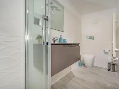 a bathroom with a shower and a toilet at Apartment Attico Dolce Vista by Interhome in Castellammare del Golfo