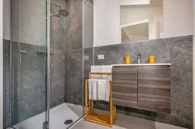 a bathroom with a shower and a sink and a tub at Villa Hemèra Luxury By Sicily Home Solutions in Castellammare del Golfo