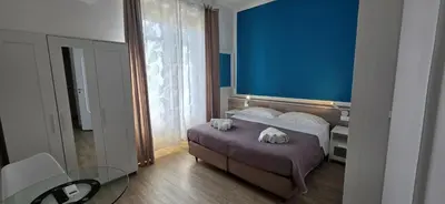 a hotel room with a bed with towels on it at Hostel Josef in Palermo