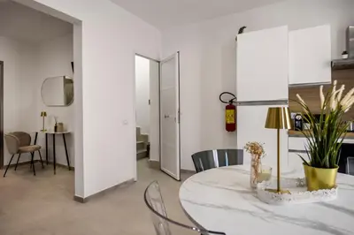 a dining room with a table and chairs and a room with a dining room at Dream Holidays - Apartments in Palermo