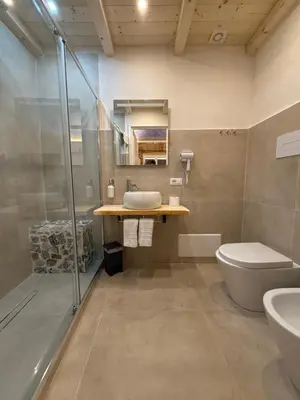 a bathroom with a sink and a toilet and a shower at La Piccola Formica in Palermo