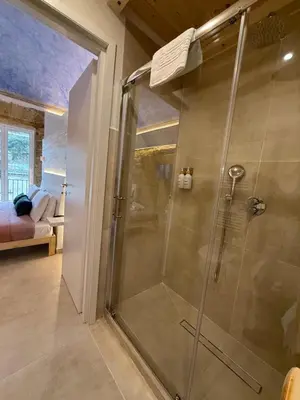 a shower with a glass door in a bathroom at La Piccola Formica in Palermo