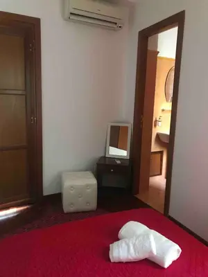 a hotel room with a bed with a towel on it at Nonno Antonio's House in Palermo