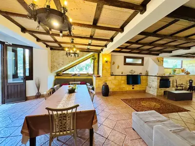 a large living room with a table and a couch at Villa Bellavista in Carini