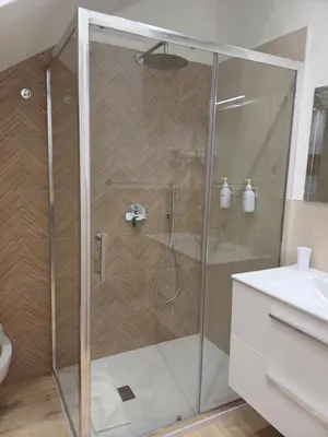 a shower with a glass door in a bathroom at Carruzzata 2 in Bagheria