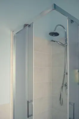 a shower with a glass door in a bathroom at Casa del Gelso Tra Palermo e Cefalù in Trabia