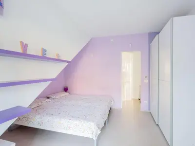 a white bedroom with a bed and a staircase at CasaSol - Live Your Sol in Alcamo
