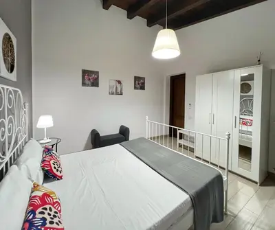 a bedroom with a bed in a room at Villa Oxidiana with pool and garden in Campofelice di Roccella