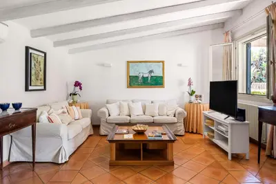 a living room with a couch and a table at Solemar Sicilia - Villa Mondello in Palermo