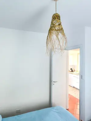 a room with a bed and a hanging ceiling at Arancina Abbronzata in Balestrate