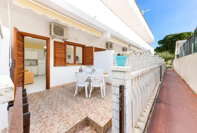 a view of the patio of a house with a table and chairs at Bilocale Piano Terra a 400 mt dal mare in San Vito lo Capo