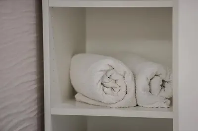 two rolls of towels sitting on a shelf at Casa Pisani 274 in Palermo
