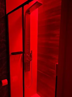 a red bathroom with a shower with red lighting at Appartamenti Pellegrino Centro in Palermo